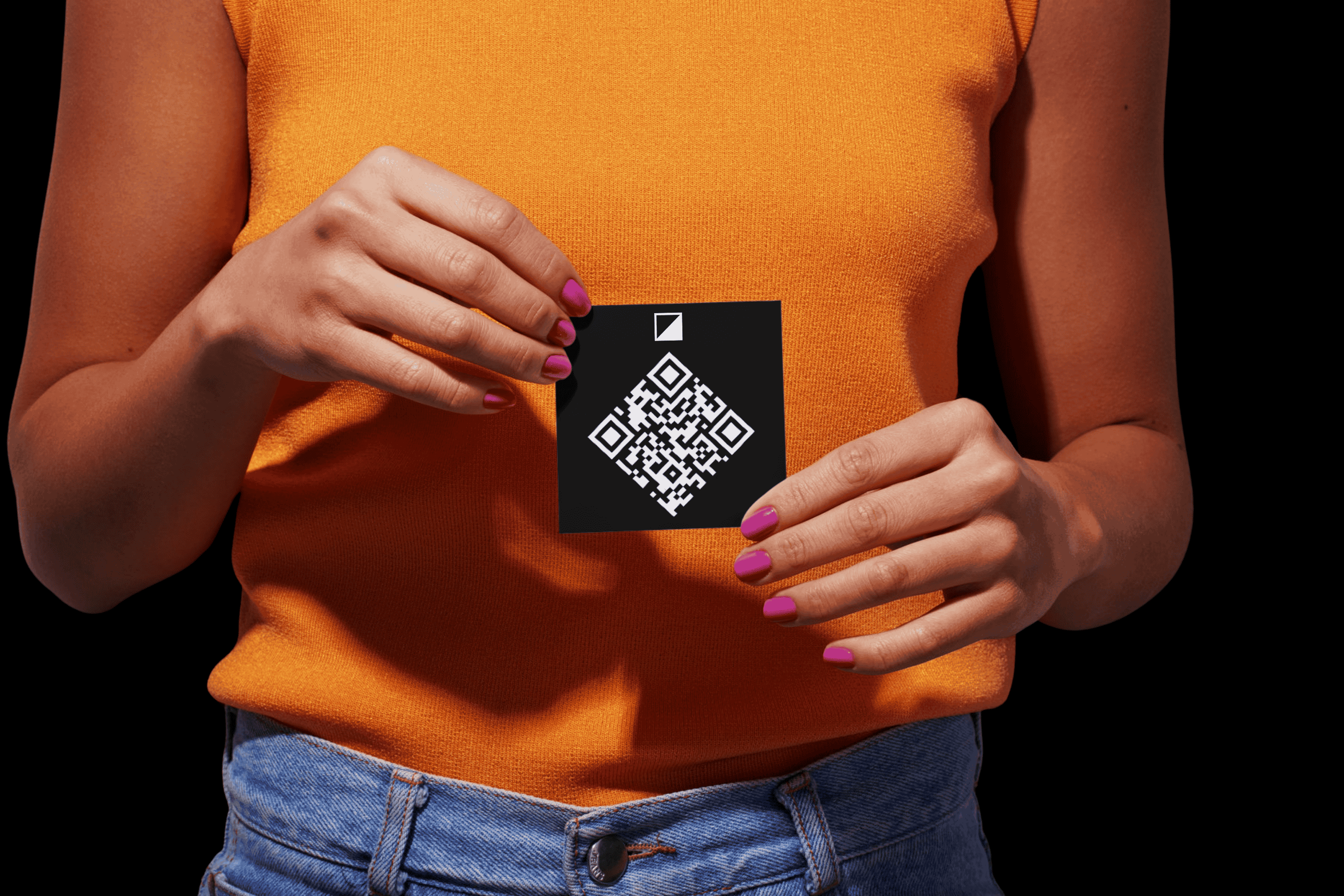 Person holding a card with a Beyond This Stones QR code memorial for headstones and gravestones against a black background